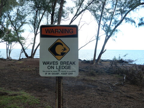 Coastal Warning Sign for Waves Breaking on Lava Ledge on Hawaii Island