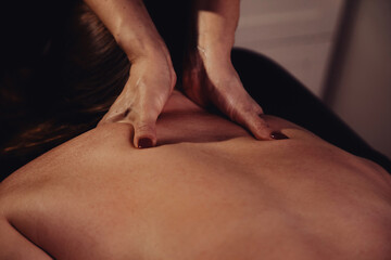 Relaxing Therapeutic Massage Session in a Dimly Lit Medical Room for Rehabilitation © Aleksandr