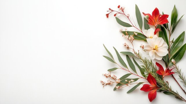 Elegant Floral Arrangement: A sophisticated bouquet featuring delicate red lilies and white blossoms, artfully arranged with lush green foliage and tiny white wildflowers.