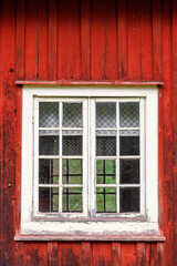 Window on a old red wooden cottage © Lars Johansson