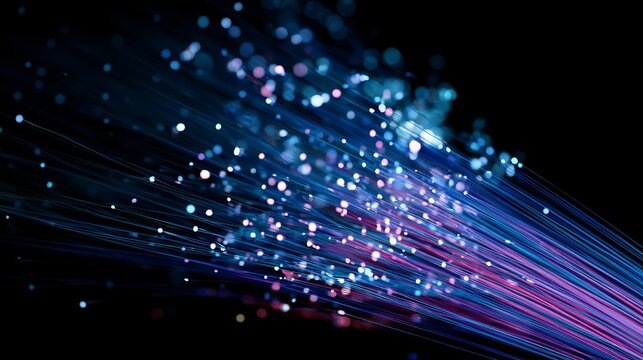 Flowing vibrant blue and magenta light trails surge forward against a dark background, representing digital connectivity and modern technology concepts