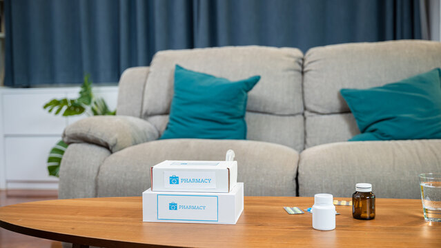Online purchase delivery of medicines to your home from drugstore, Home medicine with medicine package box free first aid kit with pills from pharmacy hospital delivery service