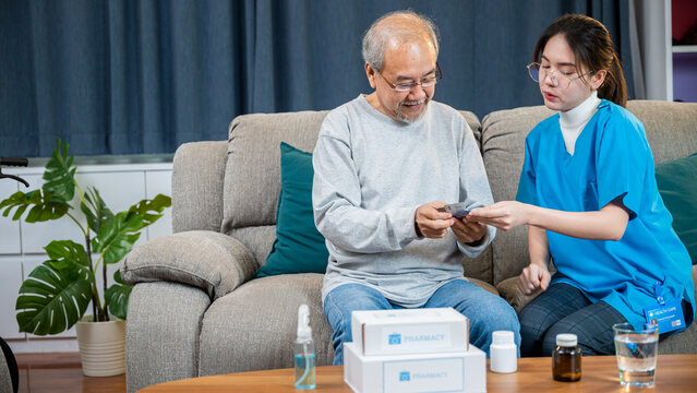 Asian doctor with physician visit senior male patient consult medicine dosage at house