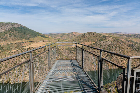 Metal platform and aerial viewpoint of the Pic&oacute;n del Moro viewpoint overlooking the cliffs, Saucelle Reservoir and waterfall. Arribes del Duero Natural Park. Salamanca, Castile and Le&oacute;n, Spain.
