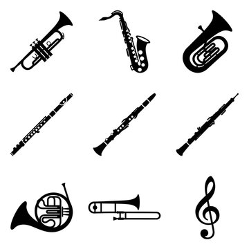 Collection of Musical Instruments Including Trumpet Clarinet Flute and Saxophone.