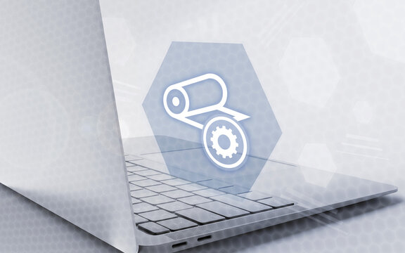 Digital illustration of a laptop computer with a settings icon representing industrial printing and manufacturing processes on a futuristic technical background.
