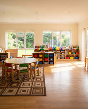 A bright, organized preschool activity classroom without people