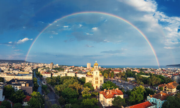 Panoramic aerial view of Varna Cathedral and city with full double rainbow in Bulgaria