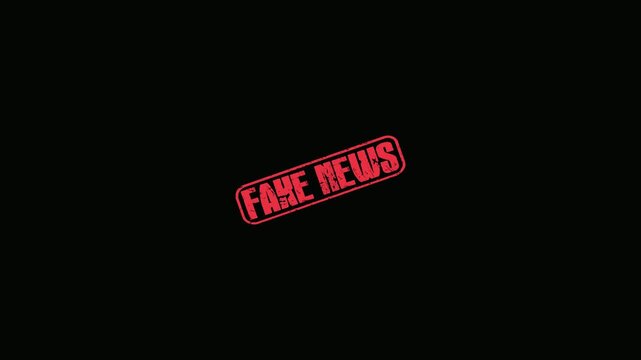 Red Fake News Rubber Stamp Impression Moving Across A Dark Black Background For Media Concept