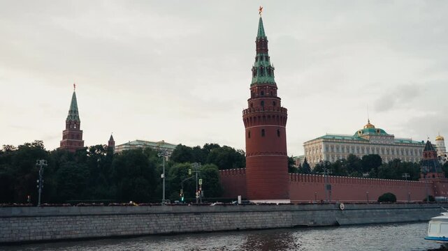 Tourist boat sailing on moskva river by kremlin