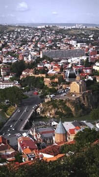 Cityscape view of Tbilisi Georgia with cable car and traffic