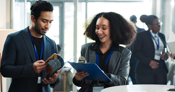 Business, people and event planner at convention with clipboard, schedule and discussion for program. Man, woman and conversation at conference with coordinator, seminar feedback and planning agenda.