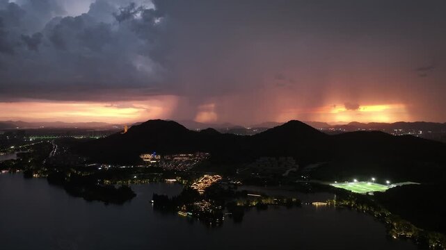 city night landscape with mountain range and heavy storm lightning
