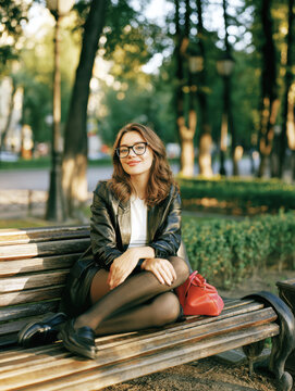 Stylish Young Woman Relaxing on Park Bench &ndash; AI Generative &ndash; No Real Persons