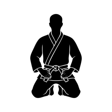 Kneeling Martial Artist Silhouette in Karate Gi Kimono Uniform
