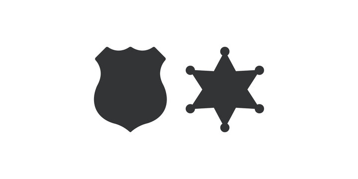 Two dark gray police badges, shield and star shaped, representing law enforcement and authority.