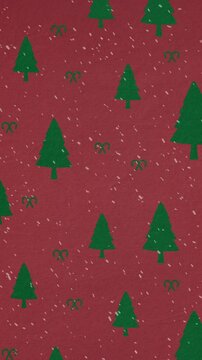 Animation of green christmas fir tree pattern with snow falling