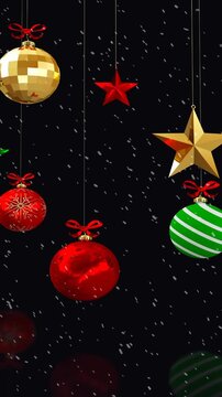 Animation of christmas decorations and baubles with snow falling