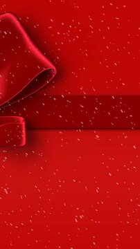 Animation of snow falling against christmas present ribbon on red