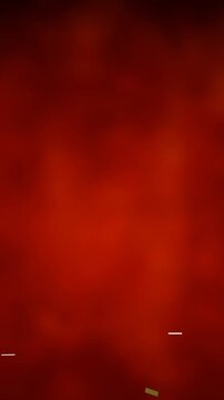 Animation of golden confetti falling over glowing red background