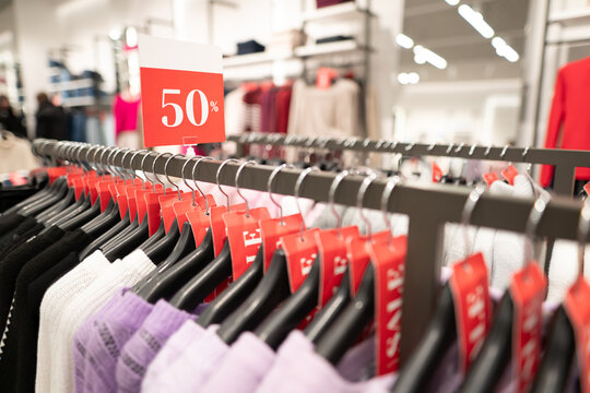 Half price discount sign at a major clothing store sale