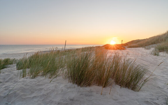 Sunrise over the Baltic Sea from sandy coastal dunes in Słowiński National Park, Poland