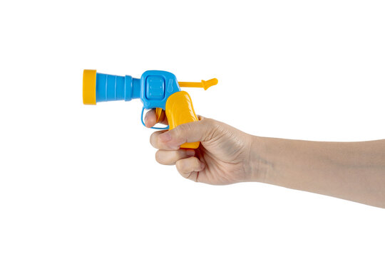 Blue plastic toy gun in hand on transparent background
