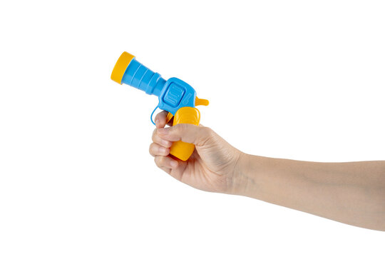Blue plastic toy gun in hand on transparent background
