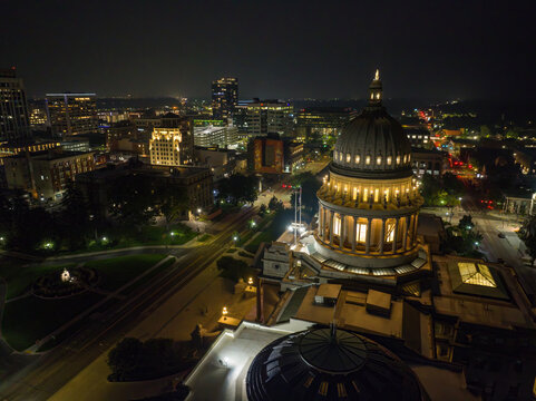 Aerial night shot of urban architecture with central dome