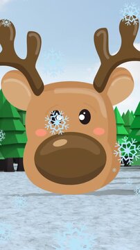 Animation of snowflakes falling over reindeer face icon and trees on winter landscape