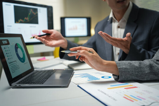 Business Team Discussing Financial Analytics in Office