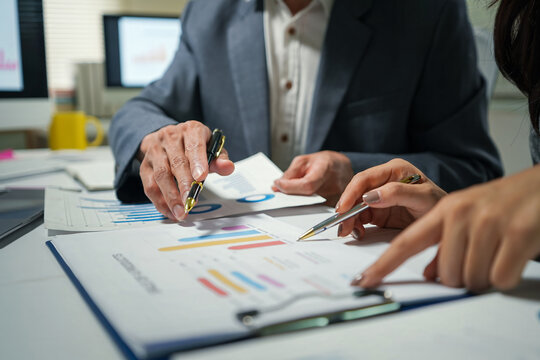 Business Team Reviewing Financial Charts in Meeting