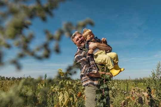 Family enjoying an autumn day in a pumpkin field