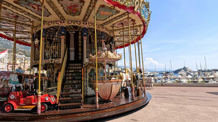 Ornate Vintage Carousel at the Monte Carlo Harbor in Monaco © blueringmedia
