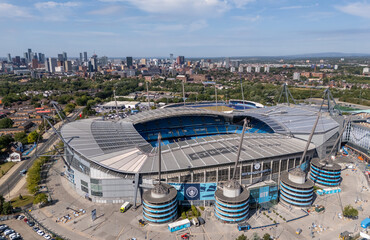 Obraz premium Etihad Stadium aerial view in Manchester, England, home of Manchester City Football Club, showing the football ground, pitch and surrounding Etihad Campus.