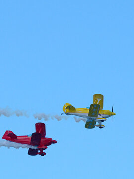 Red and Yellow Aerobatic Biplanes Flying at Pacific Airshow Gold Coast