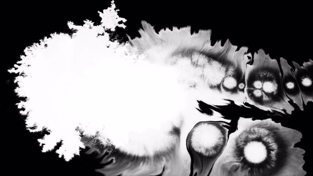 Abstract ink diffusion in water creating a dark mysterious atmosphere.
