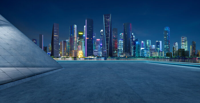 3d rendering modern city skyline at night from an empty floor