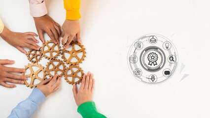 Obraz premium Group of Diverse Hands Collaborating to Assemble Wooden Gears Representing Teamwork, Innovation, and Problem Solving in a Modern Business Setting. Entropy.