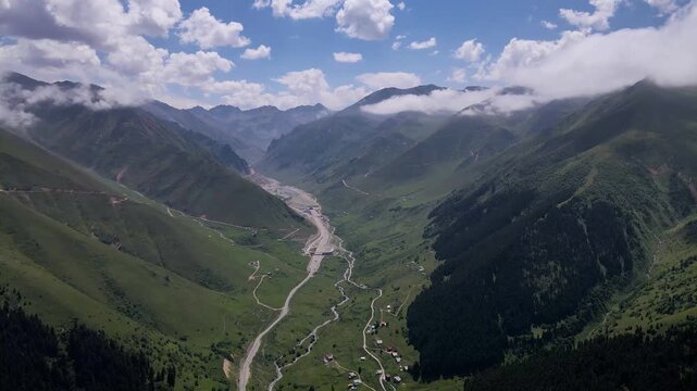 Footage of mountain villages and plateaus located among trees in pine forests.
