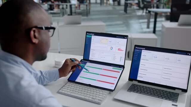 Procurement Manager Works On Laptop