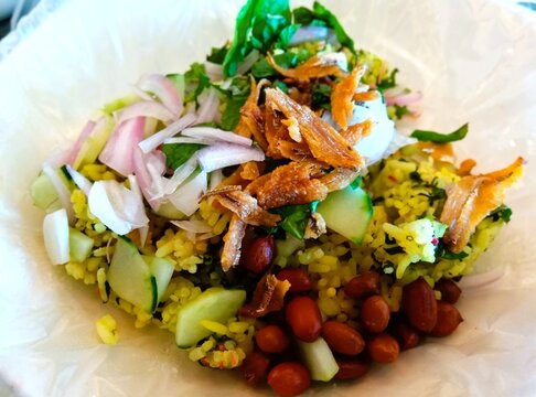 Malaysian Nasi Ulam with herbs, vegetables, peanuts and anchovies