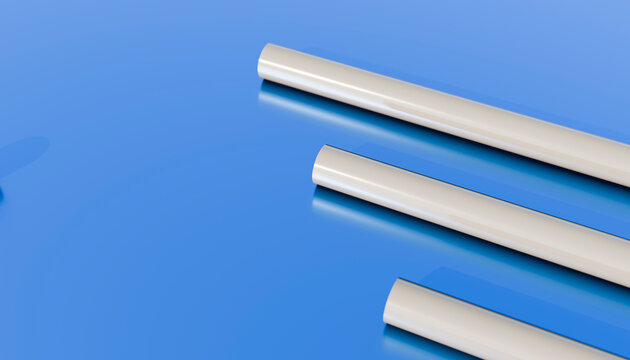Three white cylindrical plastic tubes on glossy blue surface