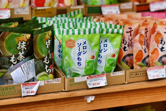 D&uuml;sseldorf, Germany - June 9th 2026: Melon Soda Mochi stand pack displayed in Asian supermarket, soft Japanese rice cake candy flavored with melon soda as a colorful modern confectionery snack