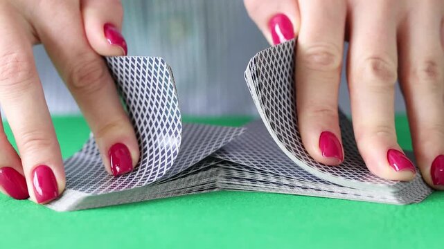 Excitement fills the air as skilled hands expertly shuffle a deck of cards during an evening of friendly competition. Laughter and strategy blend seamlessly at the table.