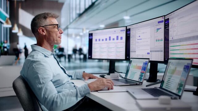 Accounts Manager Reviewing Overdue Invoices On Laptop