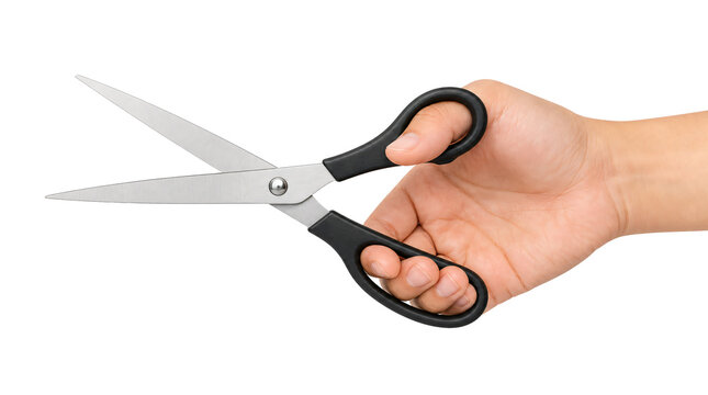Hand holding silver scissors with black handles isolated on transparent background
