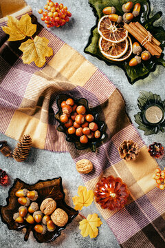 Autumn vertical background with leaf glass bowls and plaid blanket
