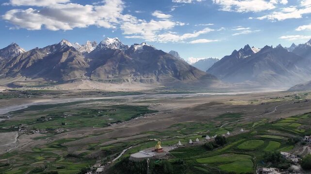 Padum, India : Panoramic aerial footage of Karsha Gompa, the largest Buddhist monastery in Padum of Zanskar valley in Ladakh, India with dramatic light over the valley and Buddha statue