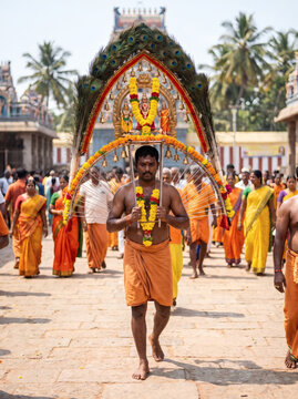Devotee carrying kavadi during Thaipusam procession